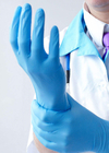Spolverizzi l'elastico blu eliminabile libero del commestibile dei guanti del nitrile